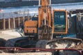 Excavator unloading sand into the dump truck on the construction site, excavating and working during road works, backhoe and Royalty Free Stock Photo