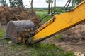 The excavator uproots trees to expand agricultural fields. The bulldozer harms the environment as a result of human activity.