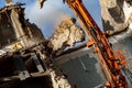 Excavator at work on demolition site Royalty Free Stock Photo