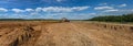 Excavator work on the pit construction of an agricultural complex in the Kaluga region of Russia. Royalty Free Stock Photo