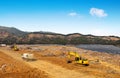 Landfill and excavator Royalty Free Stock Photo