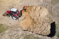 Excavator at work trenching at a construction site. Arial view Royalty Free Stock Photo