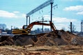 Excavator working on a construction site on railway Royalty Free Stock Photo