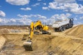 excavator is working and digging at construction site