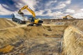 excavator is working and digging at construction site