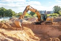 Excavator on a Construction Site Digging Earth Royalty Free Stock Photo