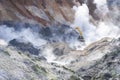 An excavator working in Jigokudani, Noboribetsu, Hokkaido. Surrounding by sulfur gas from valcano area Royalty Free Stock Photo