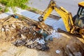 Excavator working on junk dump.Garbage the city. Soil pollution.