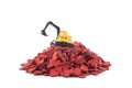 Excavator working on pile of hearts isolated on white background Royalty Free Stock Photo