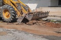 Excavator working on the Repair of pipe water on road Royalty Free Stock Photo