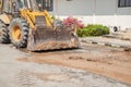 Excavator working on the Repair of pipe water on road Royalty Free Stock Photo
