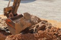 Excavator working on the Repair of pipe water and sewerage on road Royalty Free Stock Photo