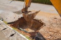 Excavator working the Repair of pipe water sewerage on road Royalty Free Stock Photo