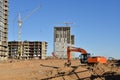 Excavator Working On Road Construction. Backhoe on Earthworks. Heavy Construction Equipment Machines. Big Red Digger at