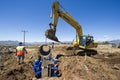 Excavator working on road. Royalty Free Stock Photo