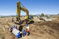 Excavator working on road. Royalty Free Stock Photo