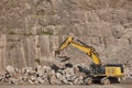 Excavator working on a stone quarry. Geological excavation equipment Royalty Free Stock Photo