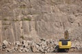Excavator working on a stone quarry. Geological excavation equipment Royalty Free Stock Photo