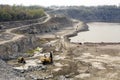 Excavator works quarrying