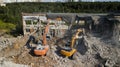 Excavators demolish building. Drone view Royalty Free Stock Photo