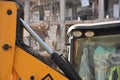 Excavators on a demolition site with old demolished building in the background. Old building being demolished to make room for new Royalty Free Stock Photo