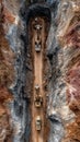 Excavators dig deep in a quarry. High angle view captures the precision of earthmoving and the scale of the industrial scene Royalty Free Stock Photo