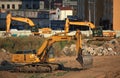 Excavators diggers at a construction site. Construction machinery at the facility Royalty Free Stock Photo