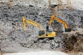 Excavators, Digging out Rock