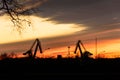 Excavators for loading coal on the background of the setting sun