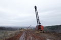 Excavators in the red clay quarry