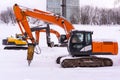 Excavators on a winter building site