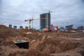 Excavtor and bulldozer digg ground at construction site for the construction of the road.