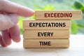 EXCEEDING EXPECTATIONS BEYOND LIMITS comes alive through assertive hand movement, driving ambition and pushing beyond conventional Royalty Free Stock Photo