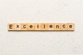 Excellence word written on wood block. Excellence text on cement table for your desing, concept Royalty Free Stock Photo