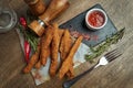 An excellent beer snack is a set of chicken nuggets fries with parchment sauce on a stone tray. Pub food. Top view Royalty Free Stock Photo