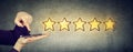 Excellent customer service concept. Man giving five star rating in online survey Royalty Free Stock Photo