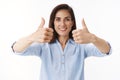 Excellent decision. Supportive good-looking adult 30s woman with tattoos, female entrepreneur give thumbs-up approval