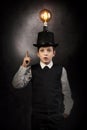 Excellent idea, kid with edison bulb above his head Royalty Free Stock Photo