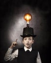 Excellent idea, kid with edison bulb above his head Royalty Free Stock Photo