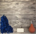 Excellent mocap with blue wool, soap, orange watering felting on a wooden background