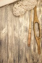 Excellent mocap two old wooden spindle with a ball of wool thread for the manufacture of woolen threads on a wooden background Royalty Free Stock Photo