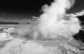 Excelsior Geyser in the Midway Geyser Basin next to the Firehole River in Yellowstone National Park in Wyoming - black and white Royalty Free Stock Photo