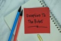 Exception to the Rules write on sticky note isolated on Wooden Table