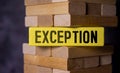 Exception word letters on wooden blocks. Uniqueness branding concept