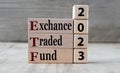 EXCHANCE TRADED FUND 2023 - words on wooden blocks on gray background Royalty Free Stock Photo