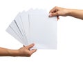 Exchange of blank paper sheets between two hands Royalty Free Stock Photo