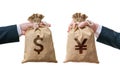 Exchange currency concept. Hands hold bag full of money - Dollar and Yen Royalty Free Stock Photo