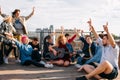 Exchange students singing rooftop together bonding