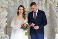 exchange wedding rings.bride and groom in an arch of flowers at wedding ceremony Royalty Free Stock Photo