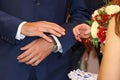 Exchange of wedding rings. Bride places the ring on the groom`s hand. Royalty Free Stock Photo